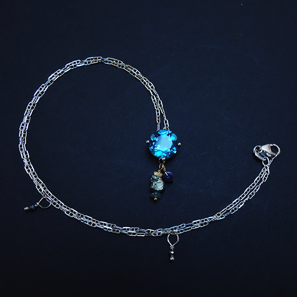 Brigid's Blessing: blue topaz, black opal, and raw pyrite