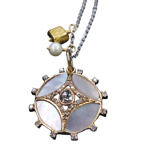 She Gleams: diamonds, mother of pearl in gold necklace