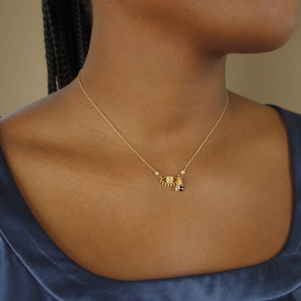 Protective Eye necklace: diamond and blue sapphire on gold