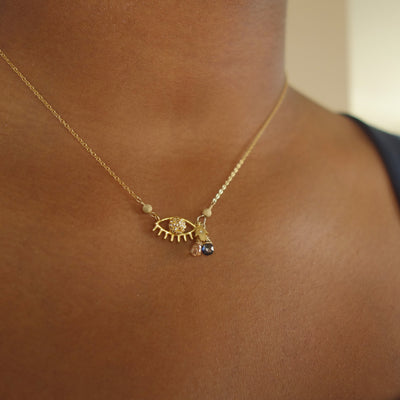 Laurie's Protective Eye necklace: diamond and blue sapphire on gold