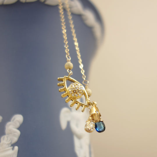 Protective Eye necklace: diamond and blue sapphire on gold