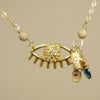 Laurie's Protective Eye necklace: diamond and blue sapphire on gold