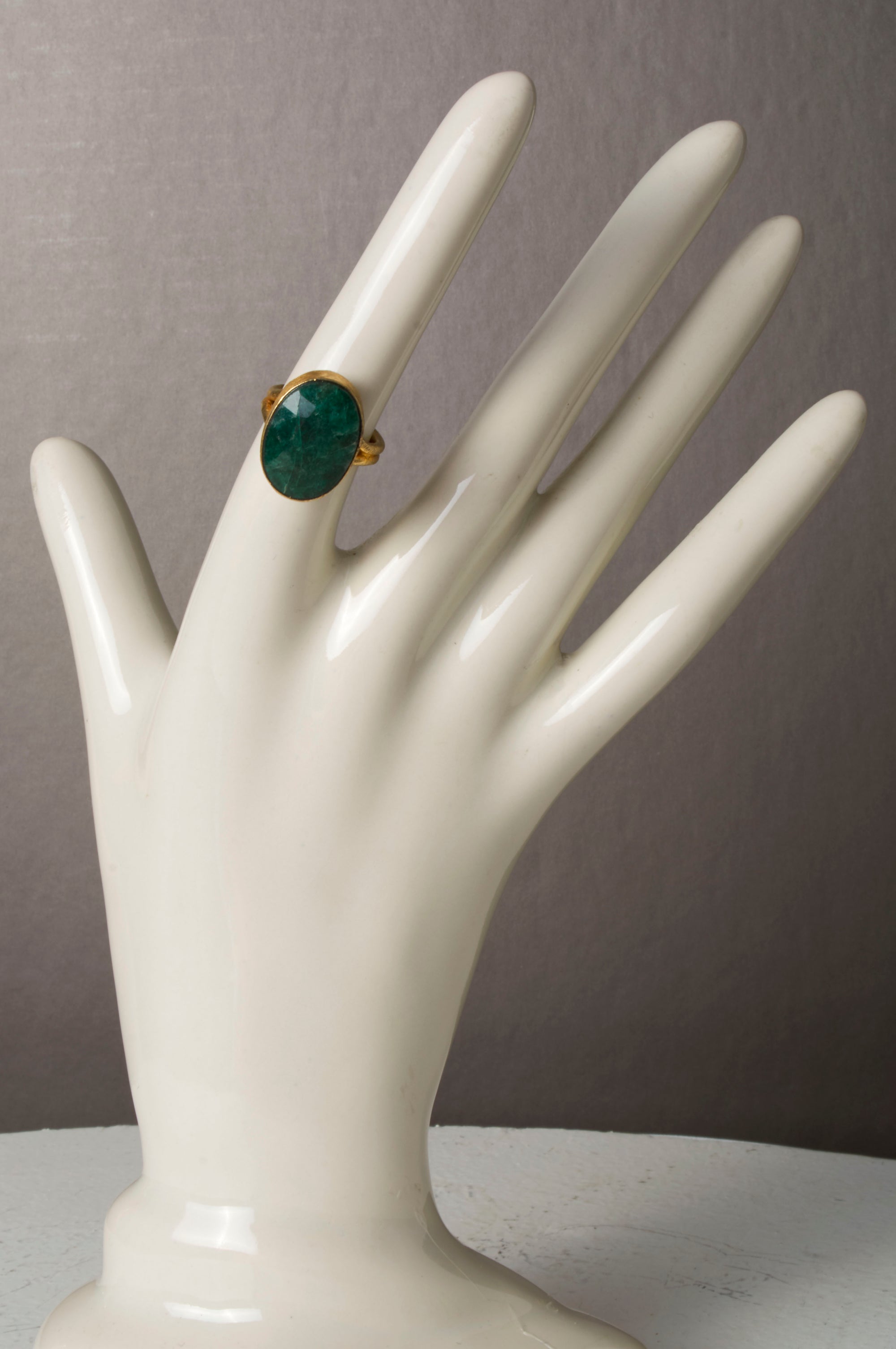 Faceted Emerald in Gold Ring