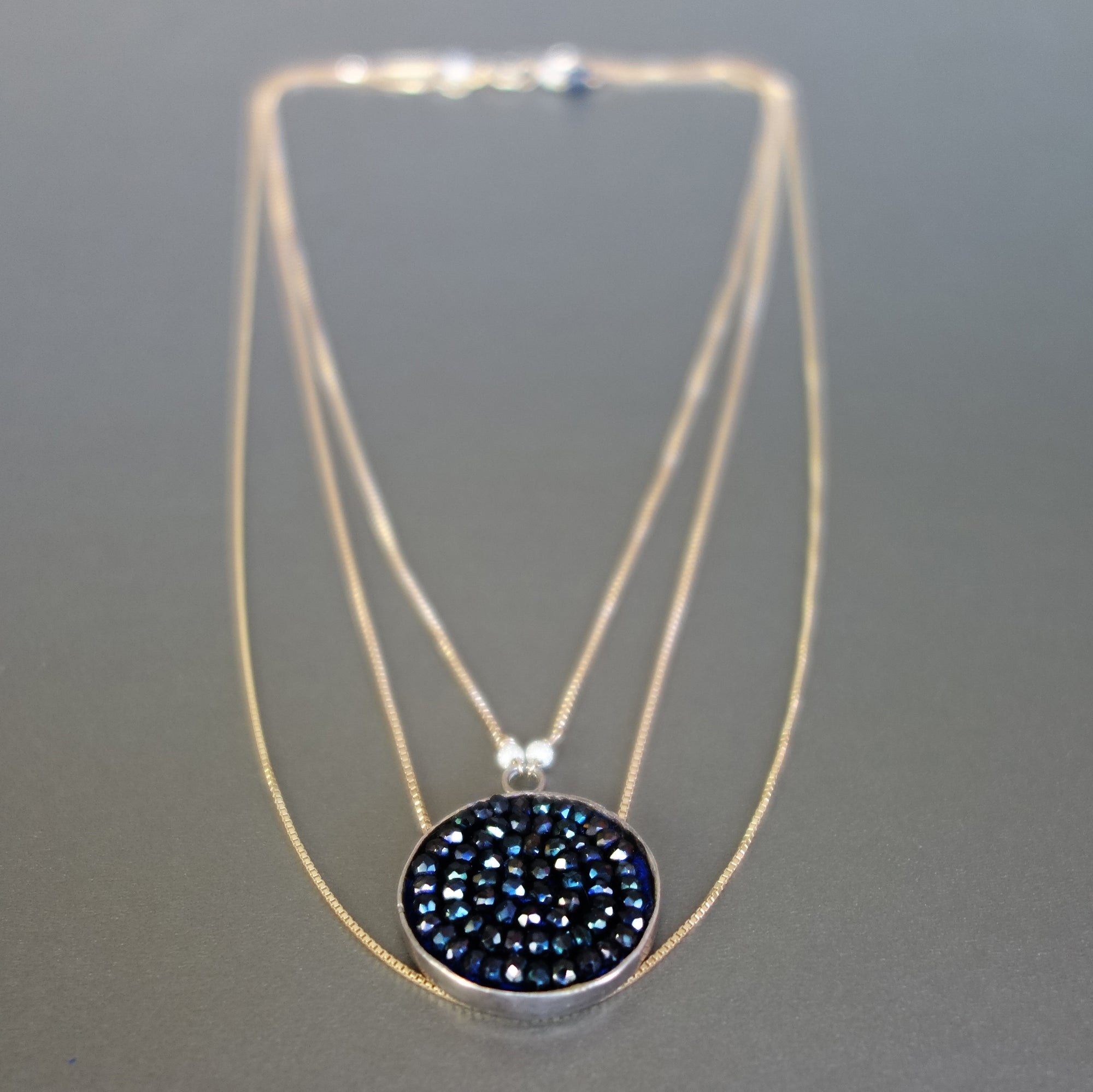 Triple Strand Gold and Blue Sapphire necklace