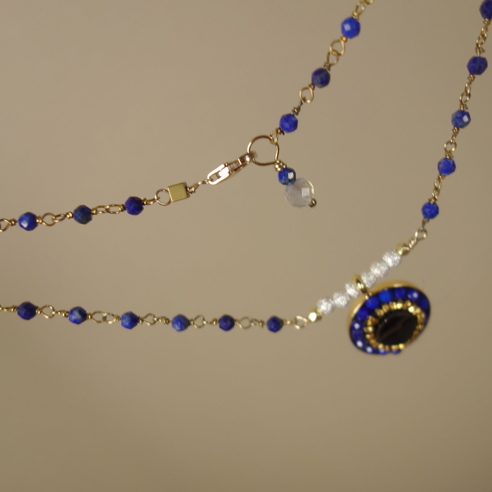 You're the One for Me: sapphire, topaz, and gold necklace