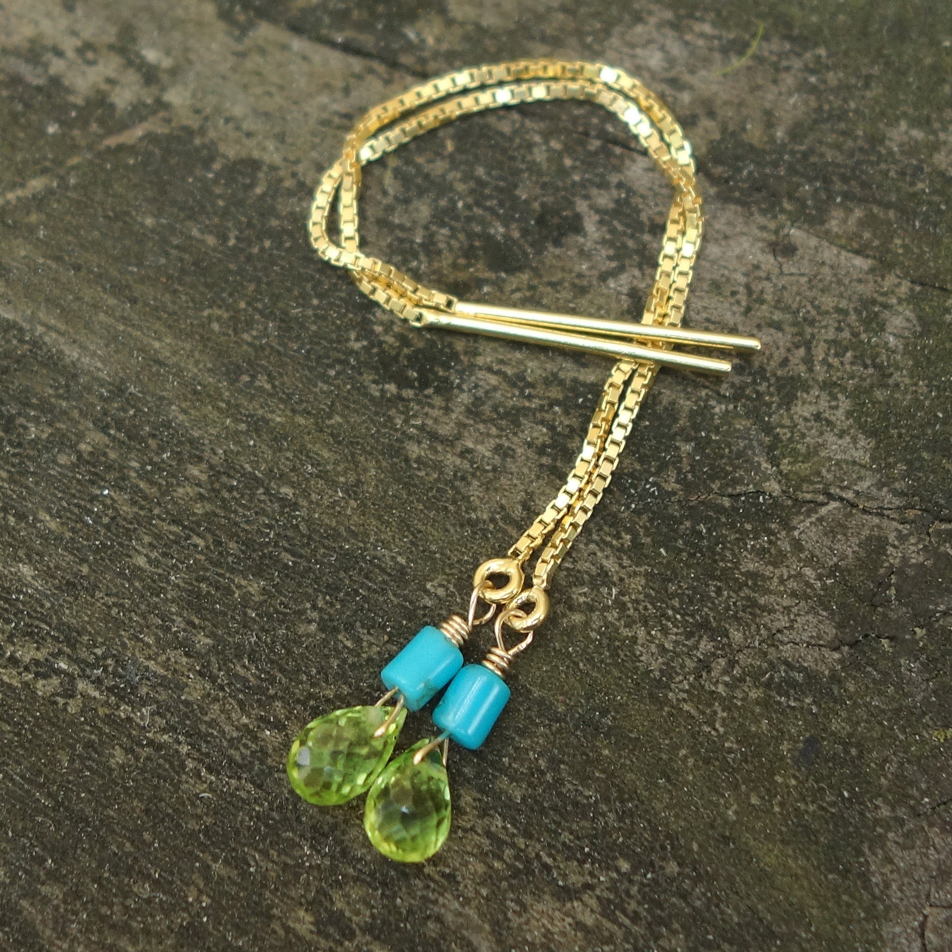 Katmandu: peridot and gold thread earring