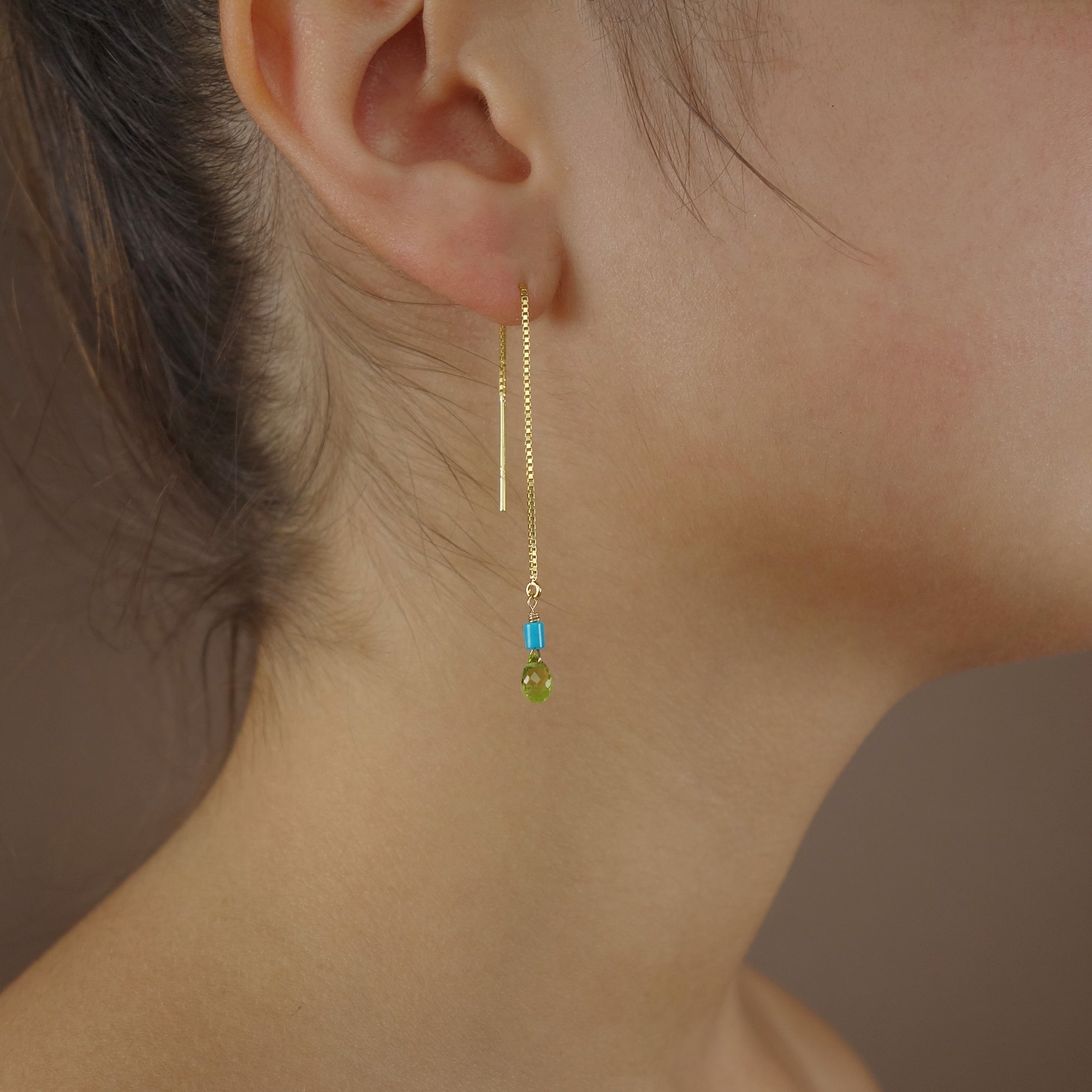 Katmandu: peridot and gold thread earring