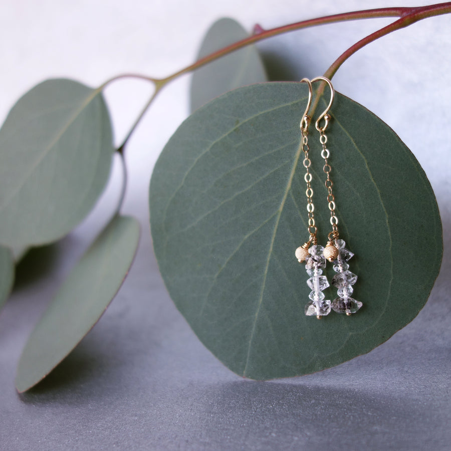 Rhudalated crystal quartz on chain ear in gold or silver