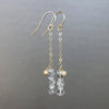 Rhudalated crystal quartz on chain ear in gold or silver