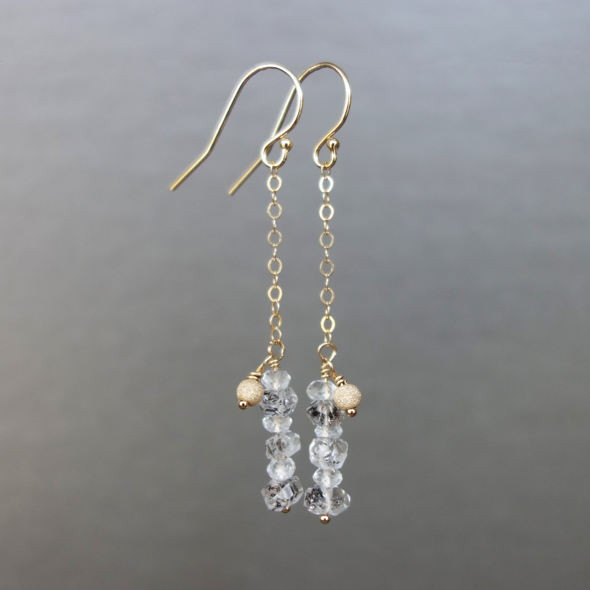 Rhudalated crystal quartz on chain ear in gold or silver