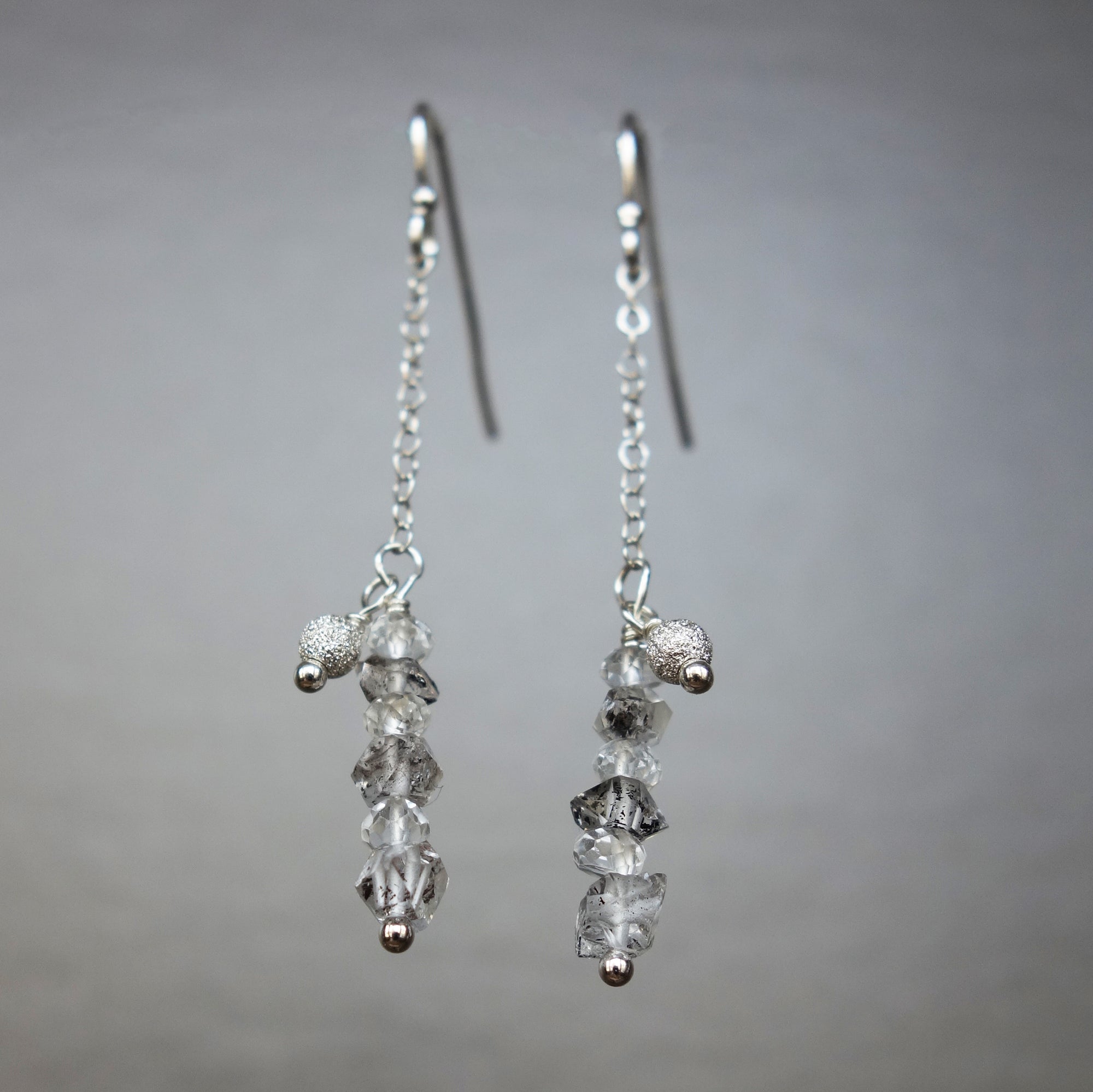 Rhudalated crystal quartz on chain ear in gold or silver