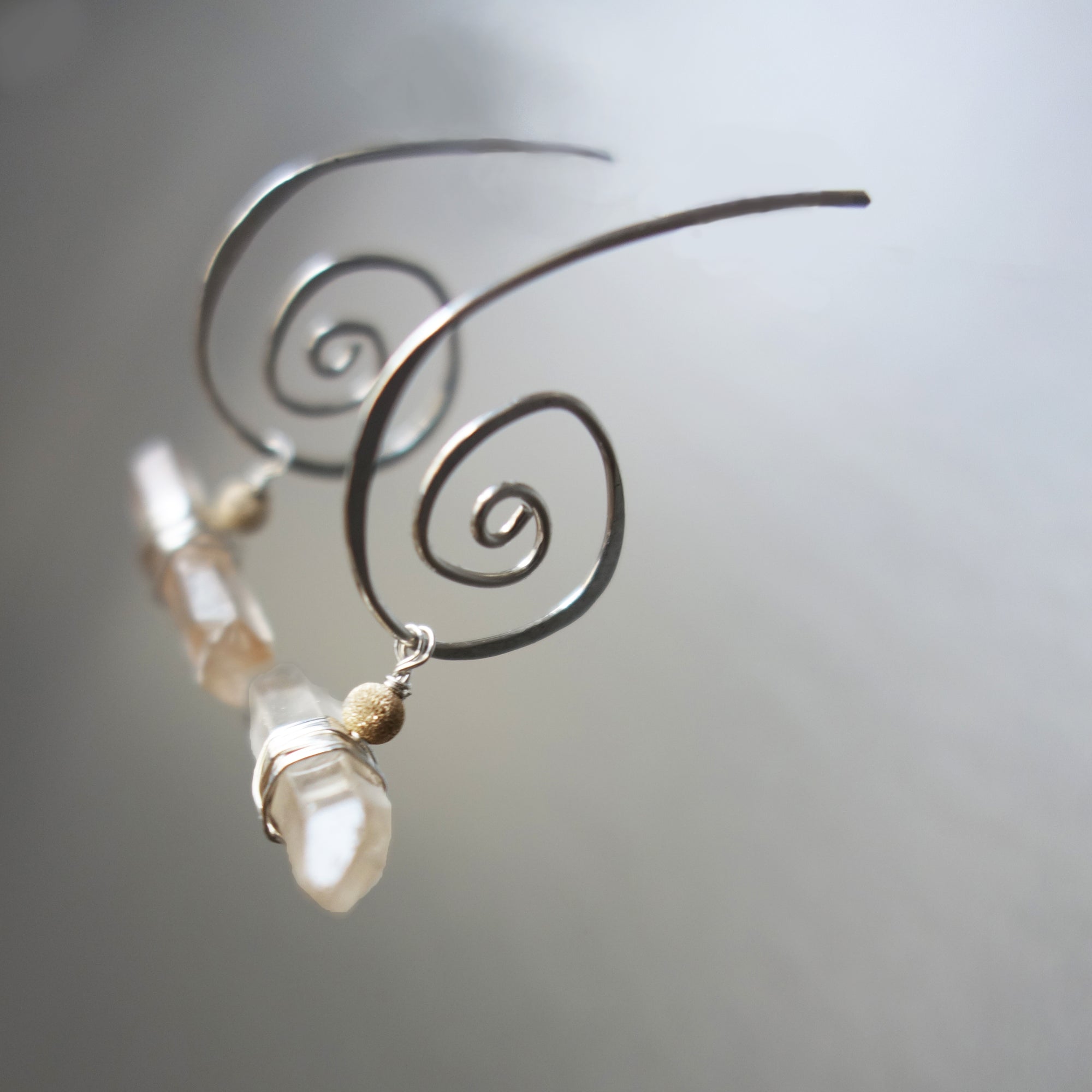 Natural Clear Quartz on Hand Hammered Silver earrings