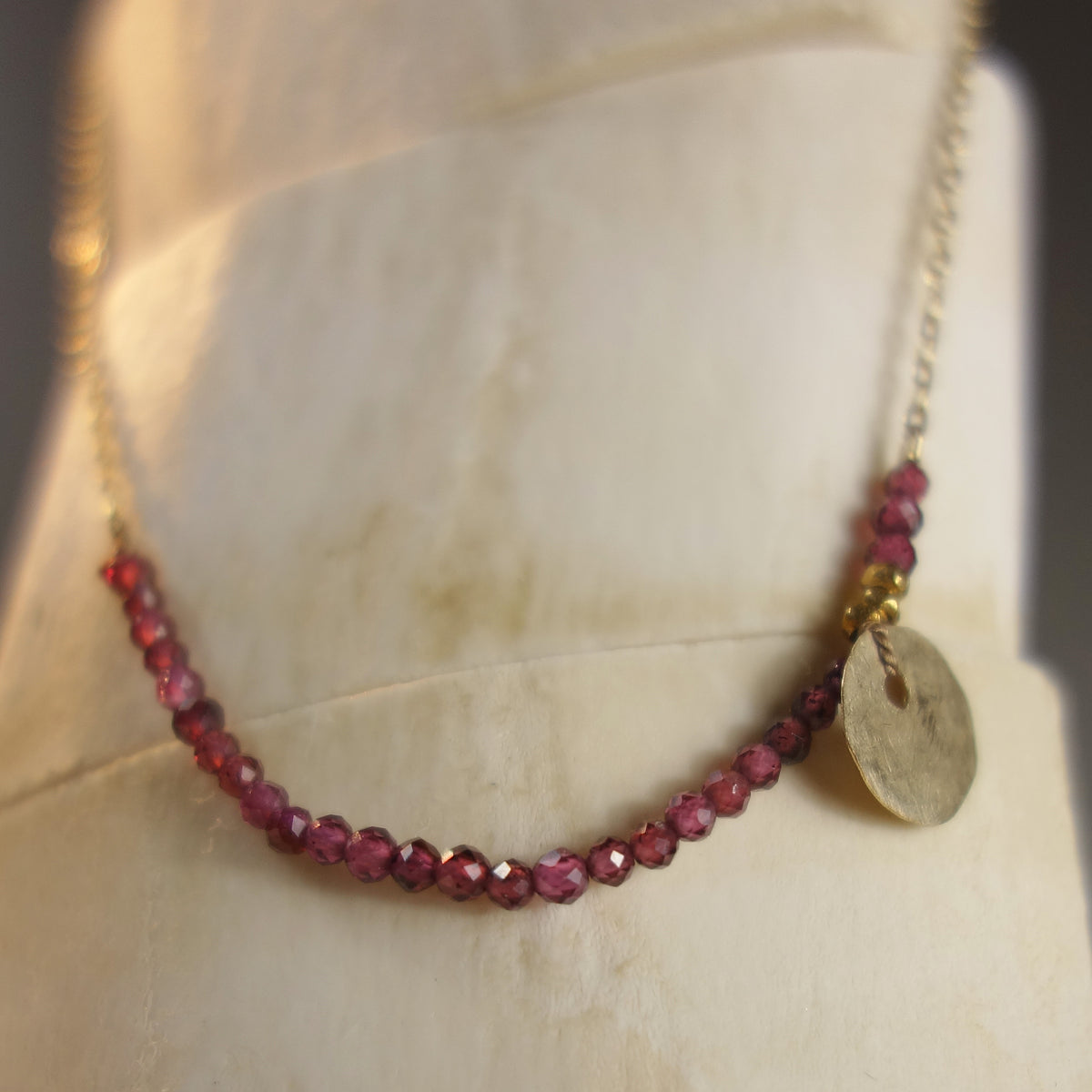 She Spoke Without Words (garnet and gold necklace)