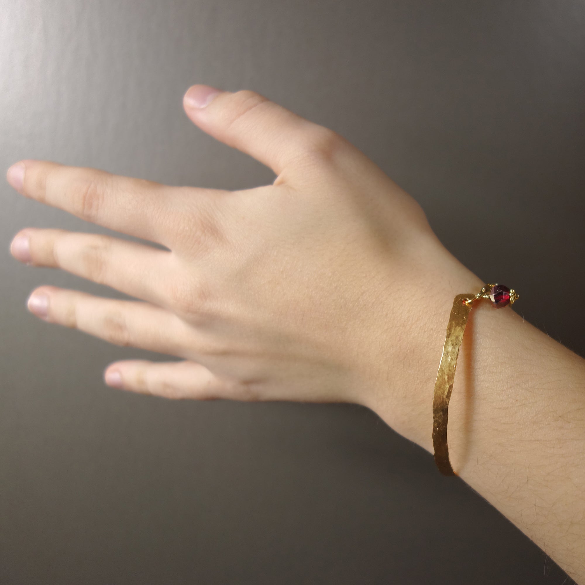 Mr. Darcy, I Presume (hand hammered gold, garnet bangle)