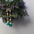 Faceted Emeralds Dancing on Gold Chain earrings