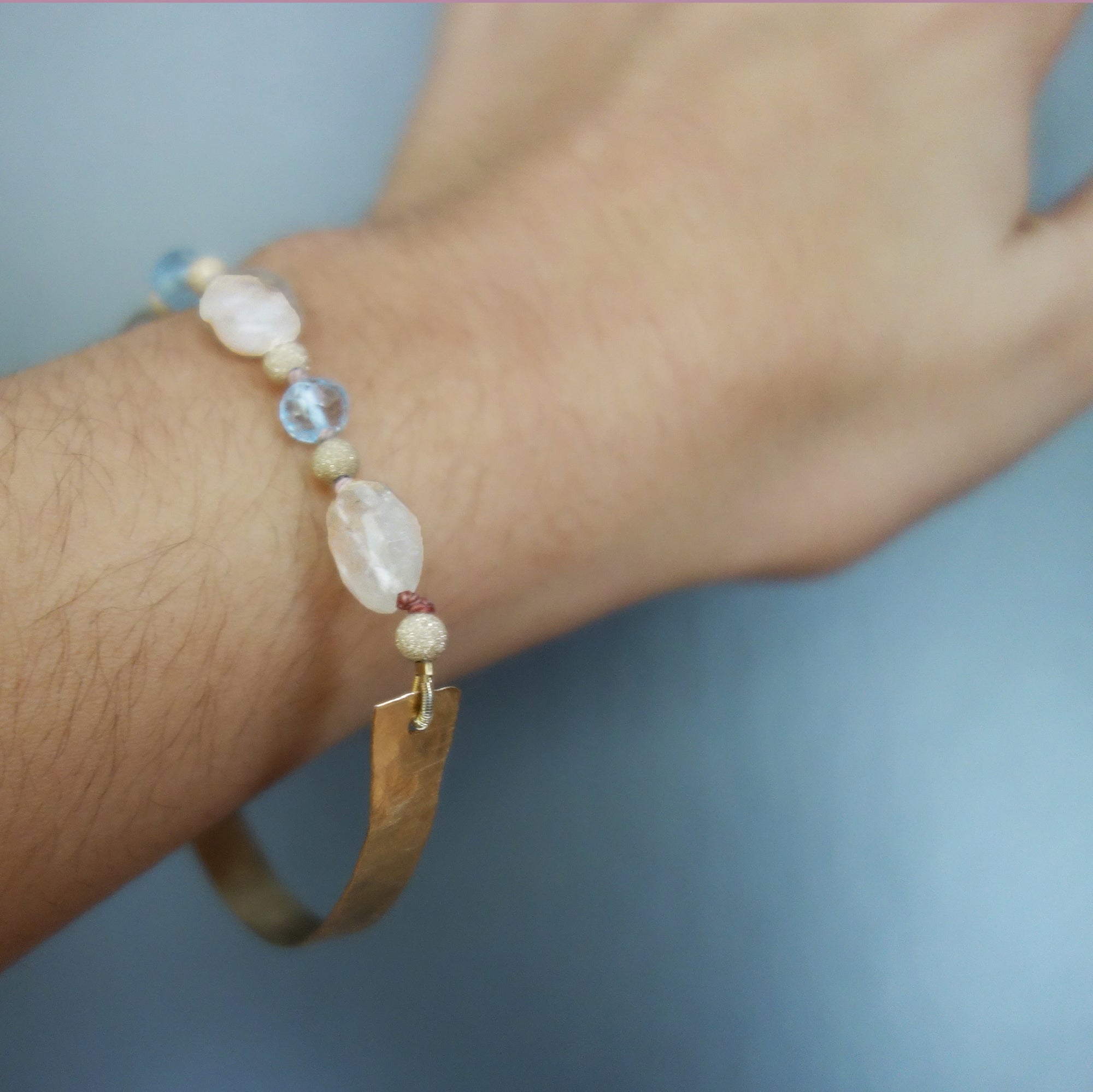 Bangle Me Beautiful (hand hammered gold and blue topaz bracelet)