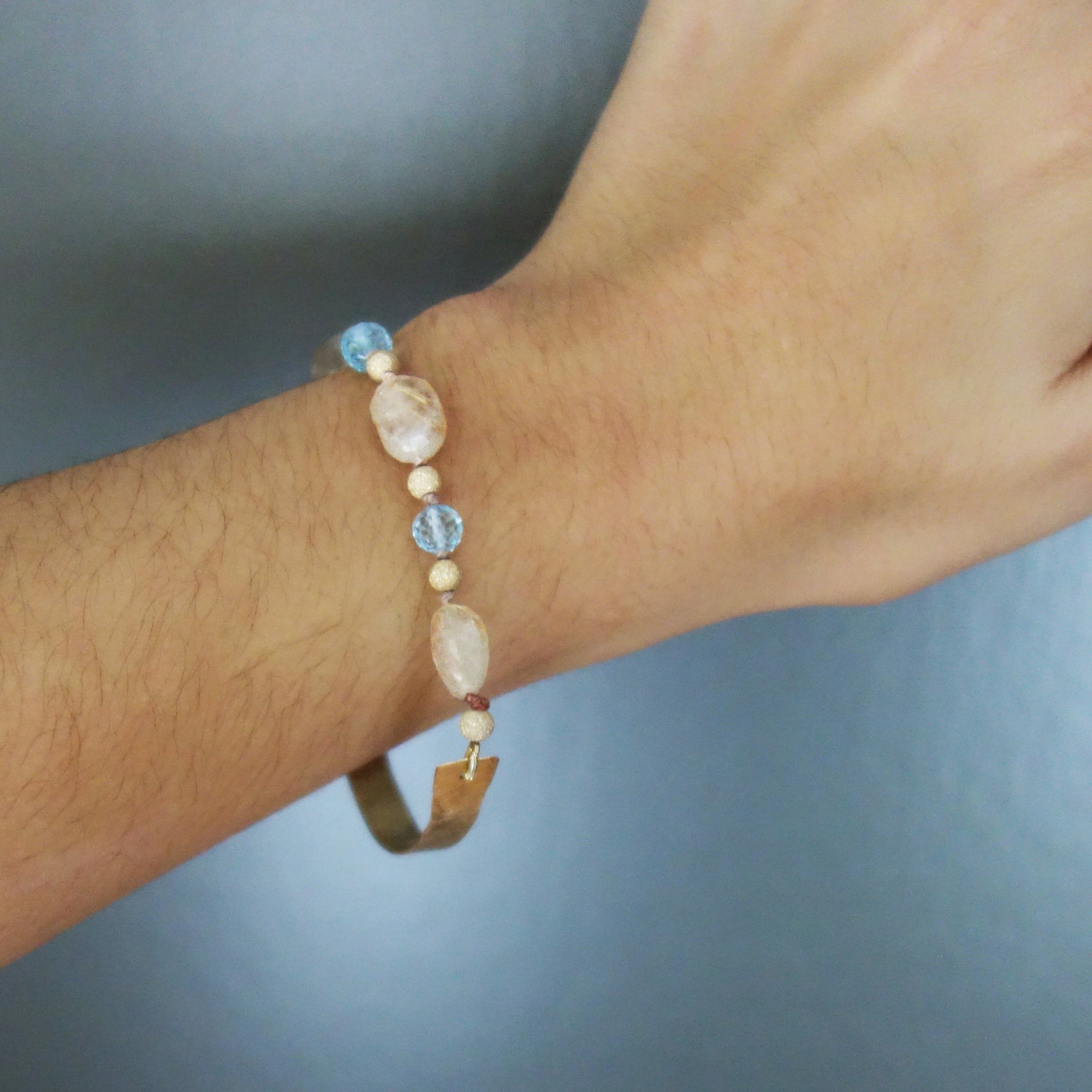 Bangle Me Beautiful (hand hammered gold and blue topaz bracelet)