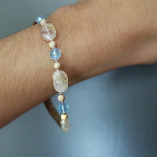 Bangle Me Beautiful (hand hammered gold and blue topaz bracelet)