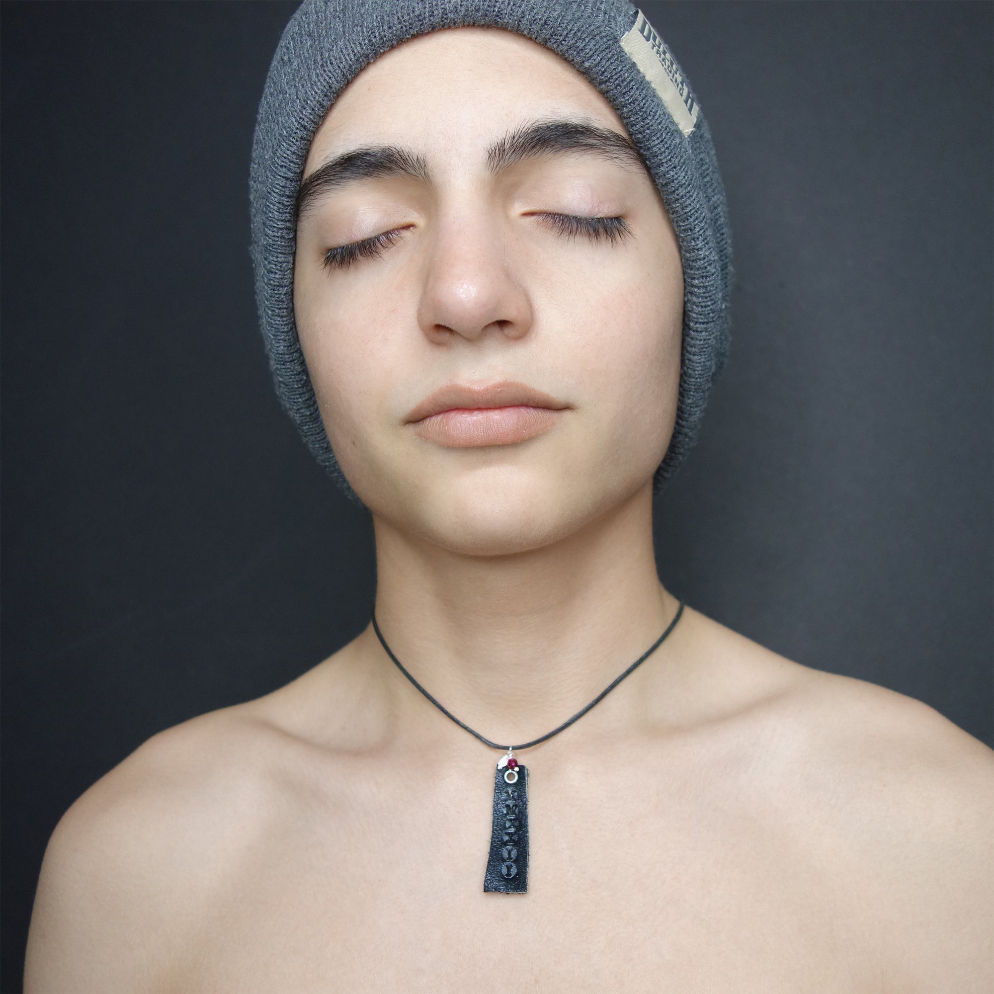 Leather stamped MMXXIV with school colors (gems)