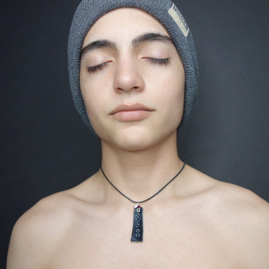 Leather stamped MMXXIV with school colors (gems)