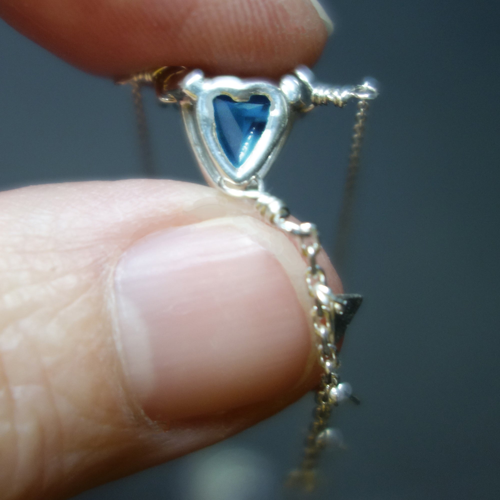 Her Secret Heart: blue topaz necklace with secret heart backing