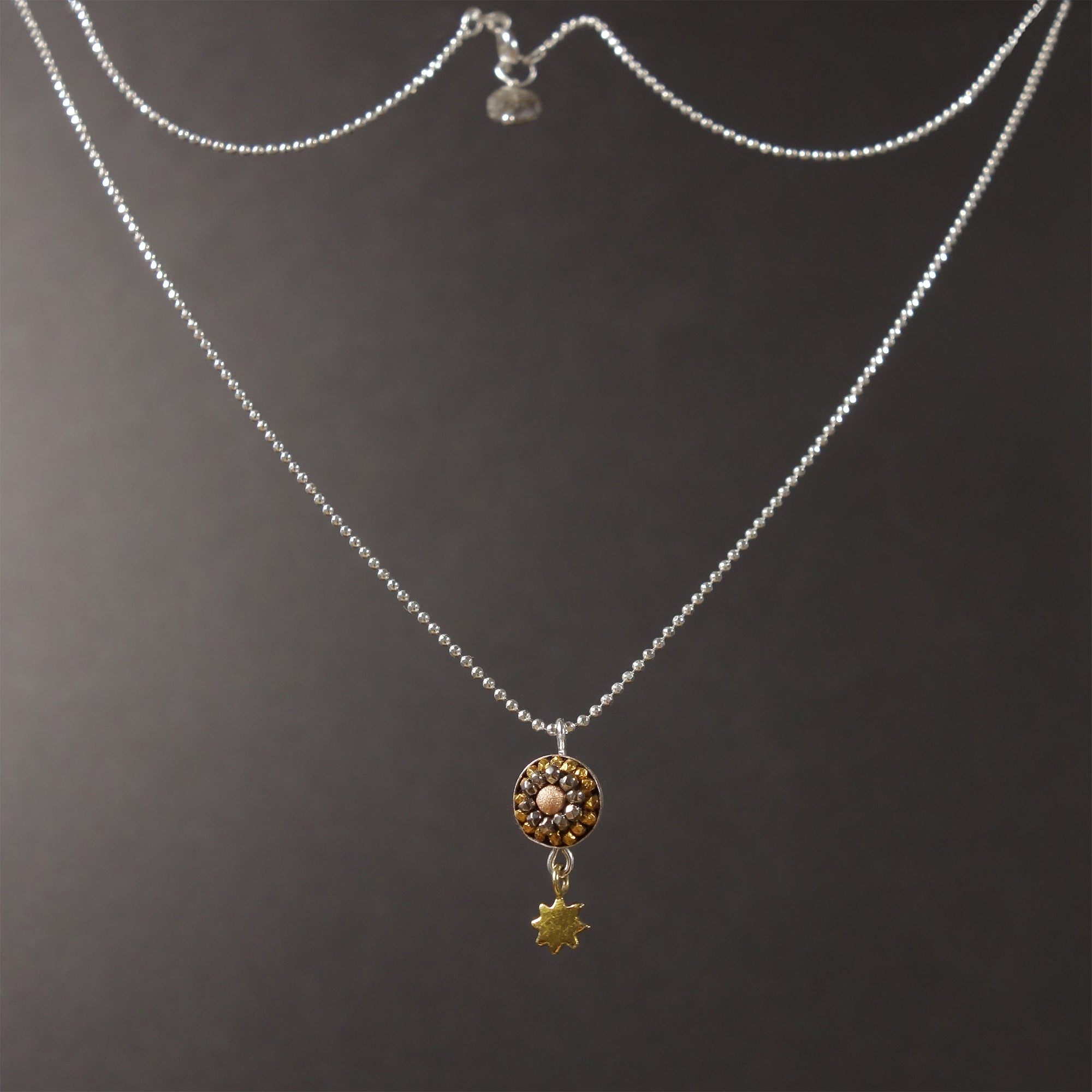 The Sun Also Rises: tiny mosaic/sun pendant necklace