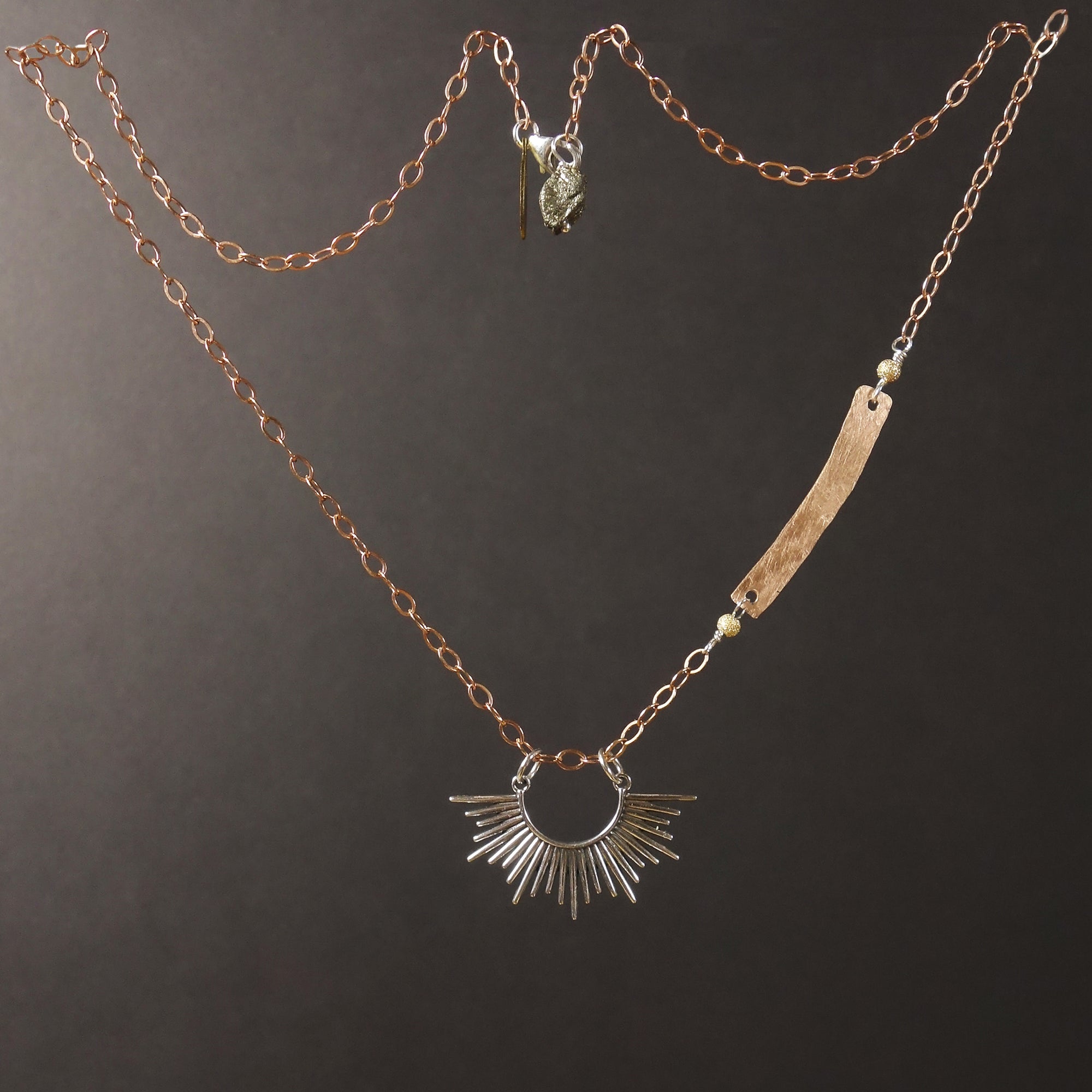 Starburst, darling: silver and hand hammered rose gold necklace
