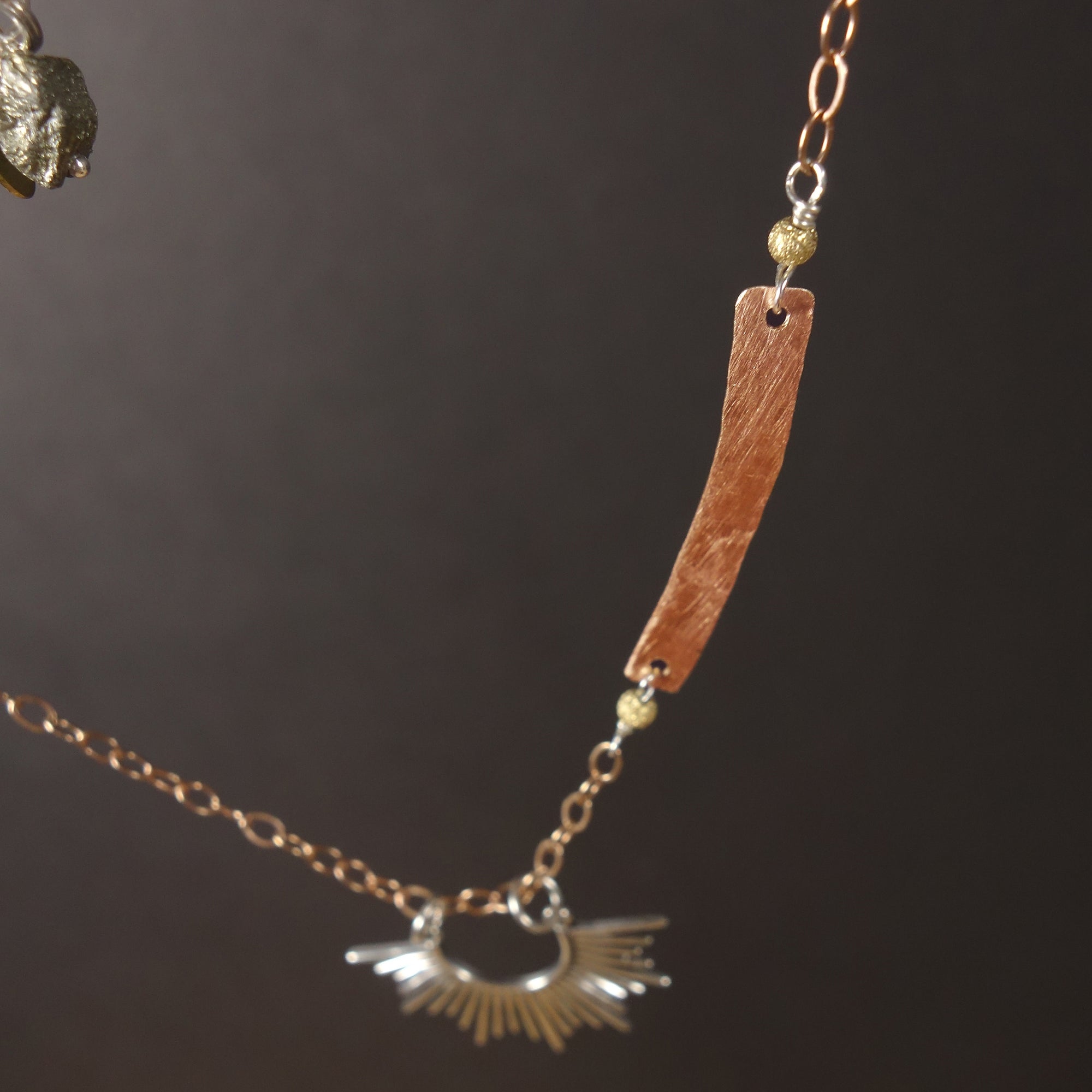 Starburst, darling: silver and hand hammered rose gold necklace