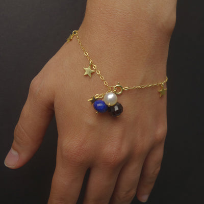 The Stars at Night: lapis, garnet, and pearl gold stars bracelet
