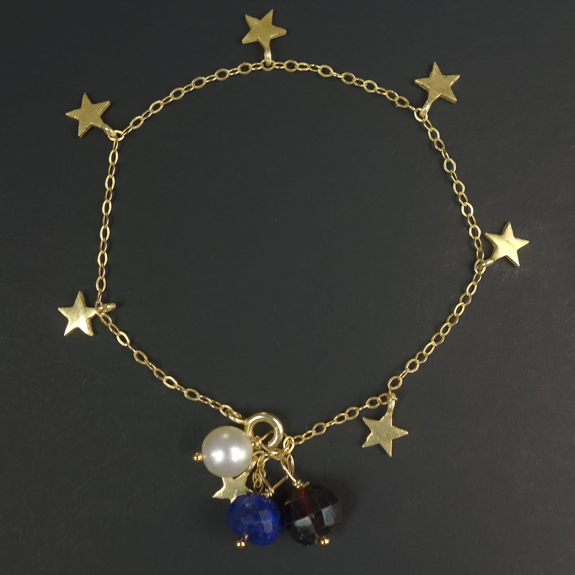 The Stars at Night: lapis, garnet, and pearl gold stars bracelet