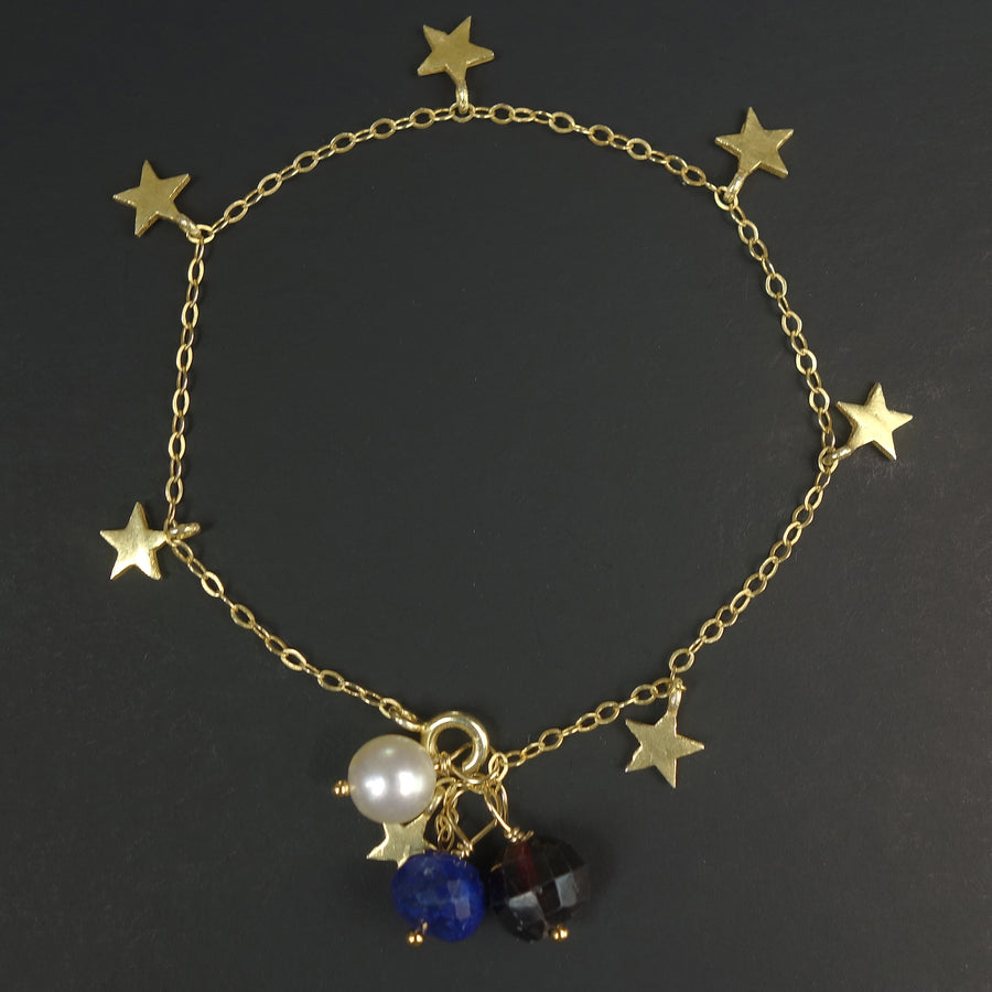 The Stars at Night: lapis, garnet, and pearl gold stars bracelet