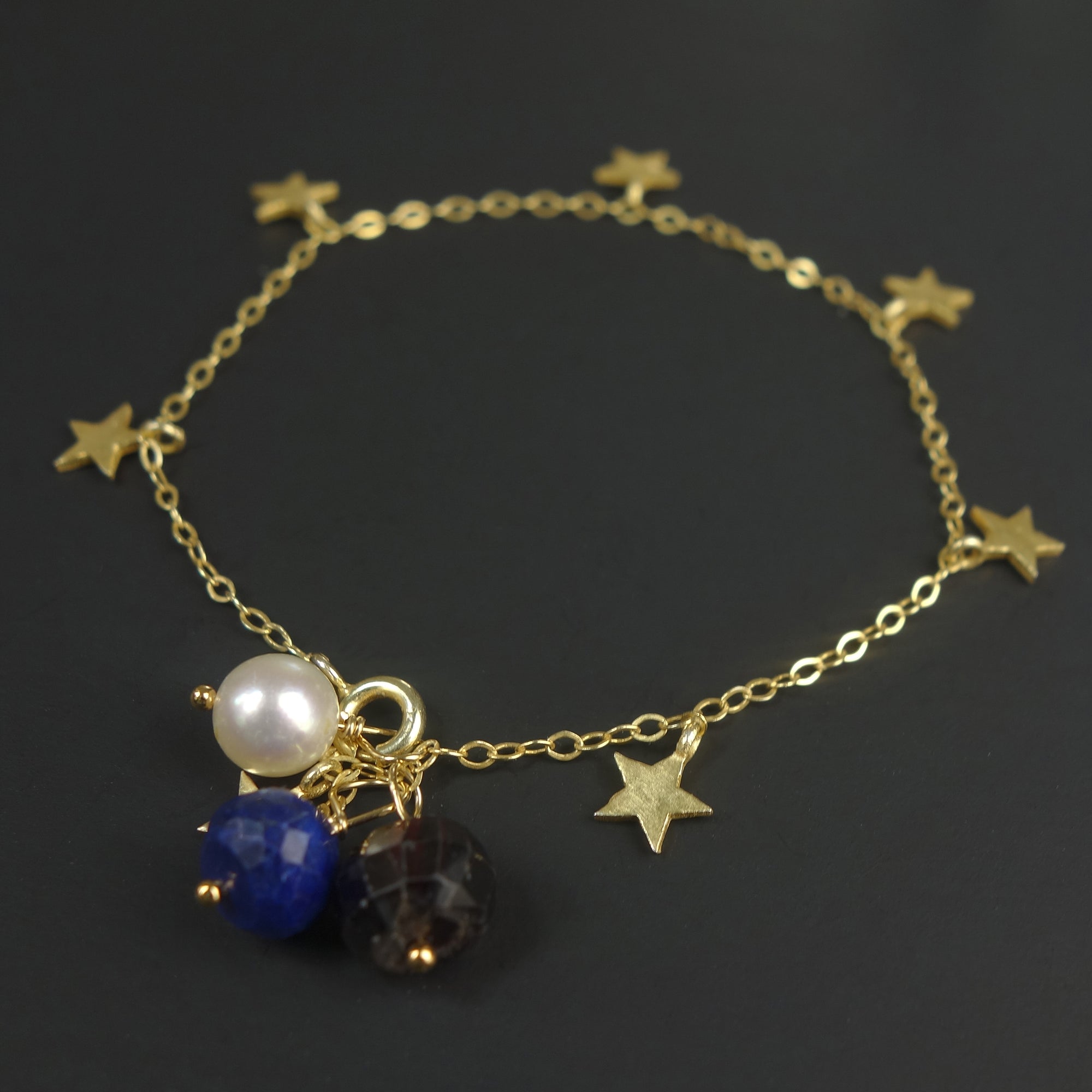 The Stars at Night: lapis, garnet, and pearl gold stars bracelet