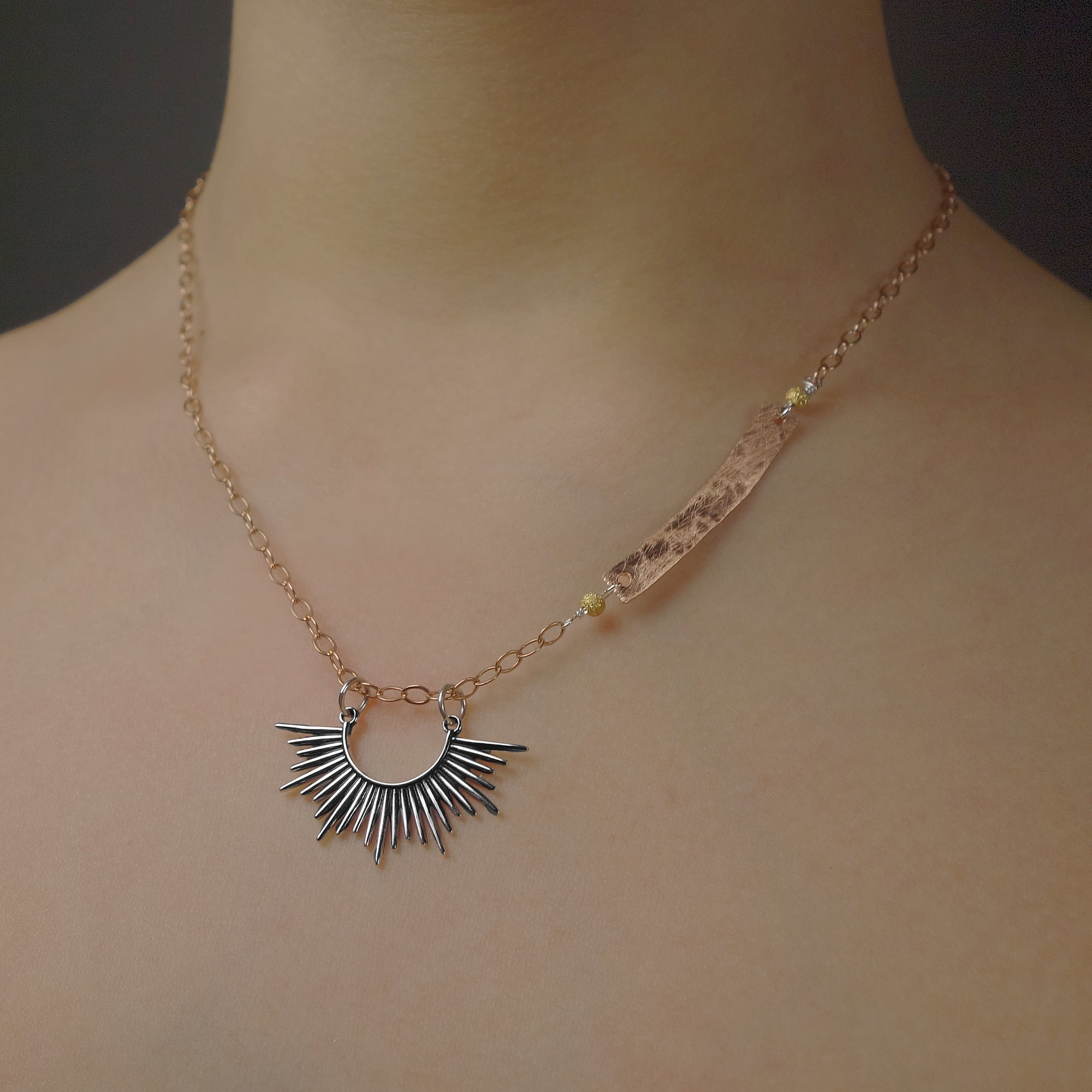 Starburst, darling: silver and hand hammered rose gold necklace
