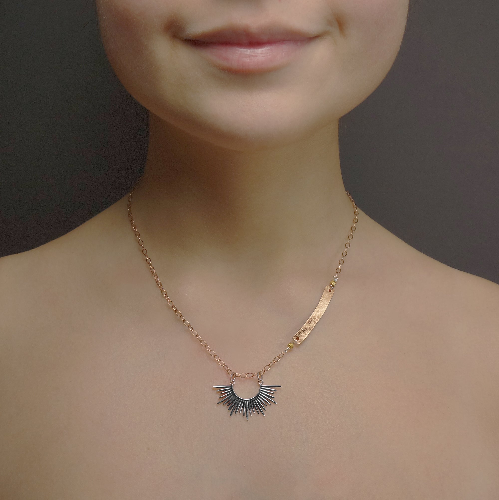 Starburst, darling: silver and hand hammered rose gold necklace