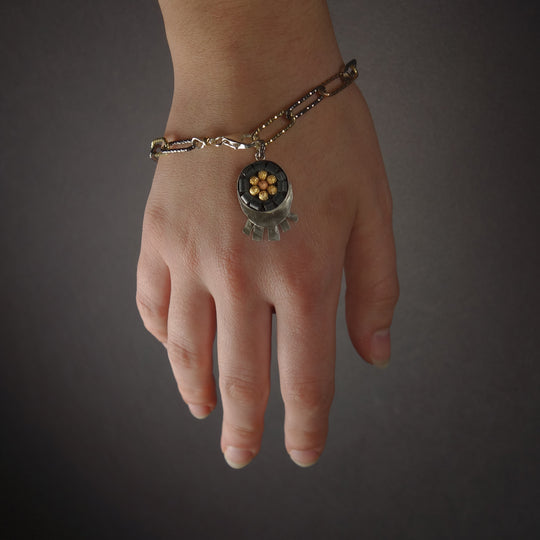 Sunrise, Sunset: silver, onyx, and gold bracelet