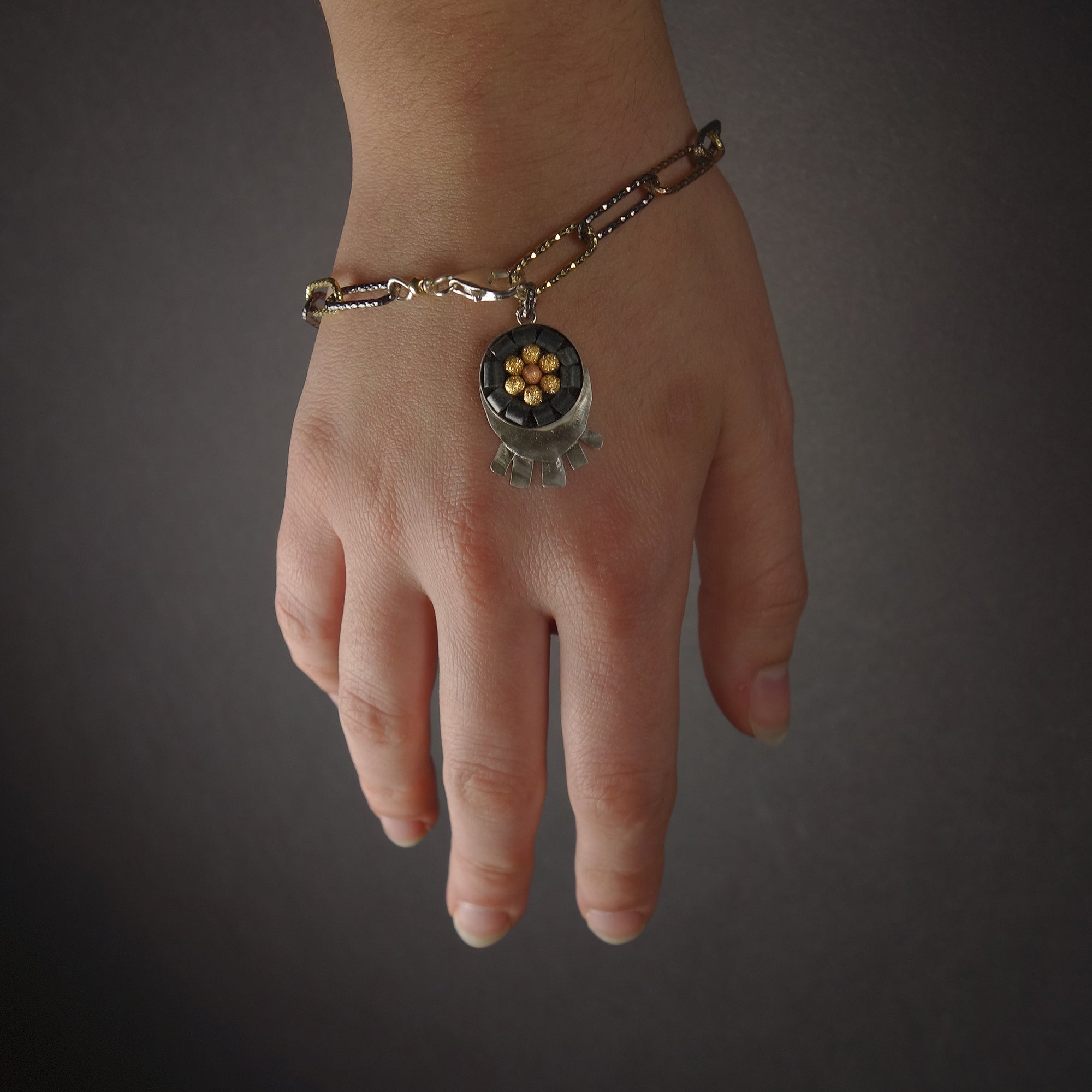 Sunrise, Sunset: silver, onyx, and gold bracelet