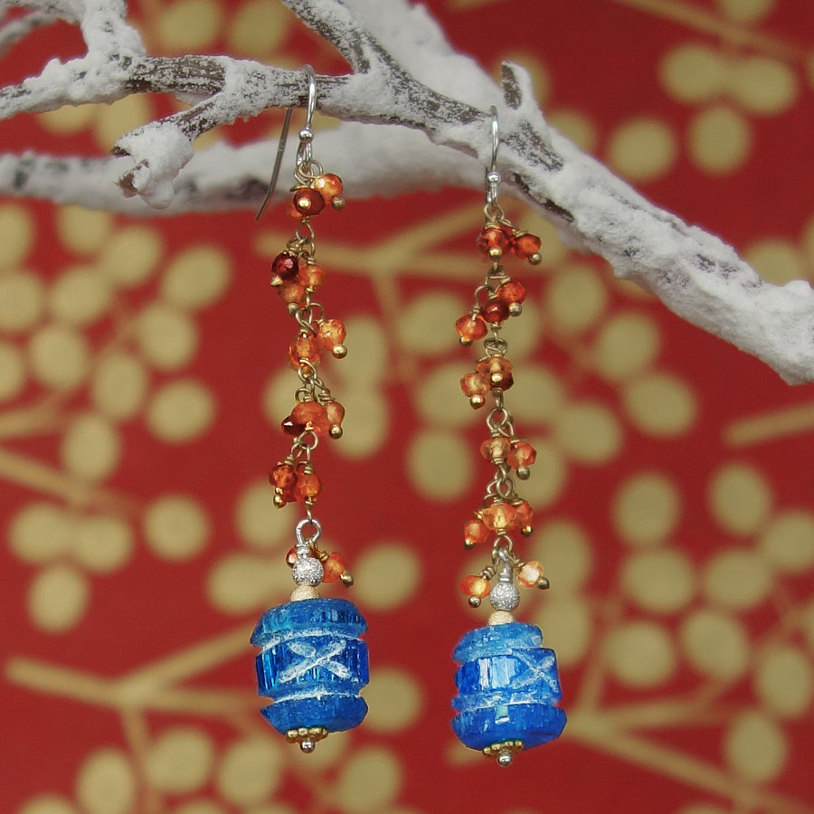 Carved apetite and hessonite garnet earring