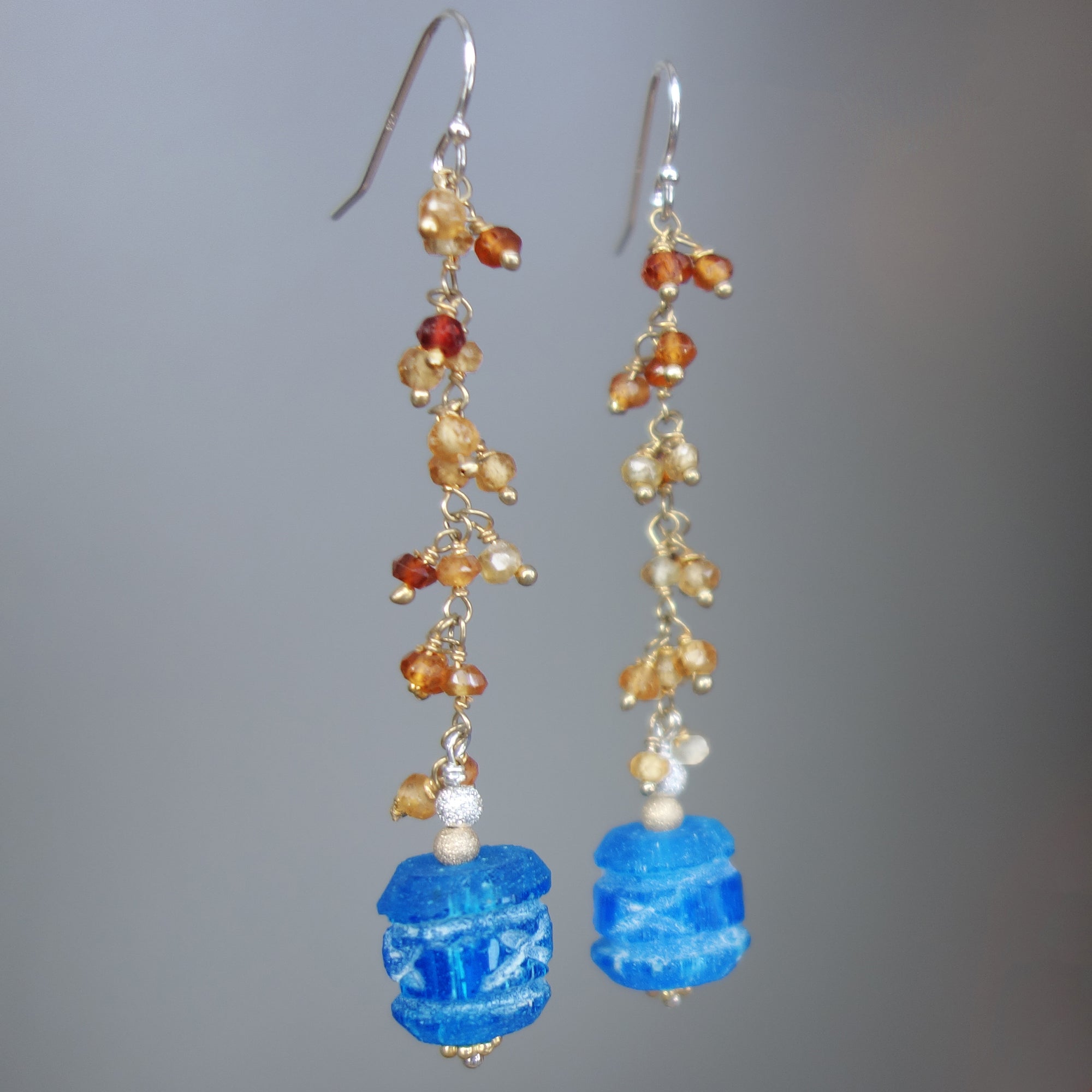Carved apetite and hessonite garnet earring