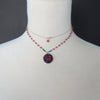 Axios: ruby, iolite, gold mosaic necklace