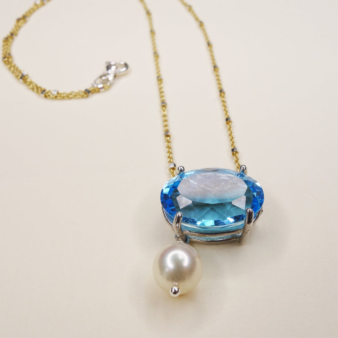 She Moves in Hues of Blues: Swiss topaz, pearl, and gold