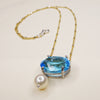 She Moves in Hues of Blues: Swiss topaz, pearl, and gold