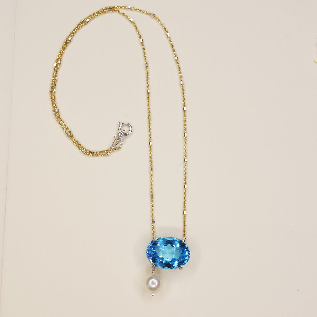 She Moves in Hues of Blues: Swiss topaz, pearl, and gold