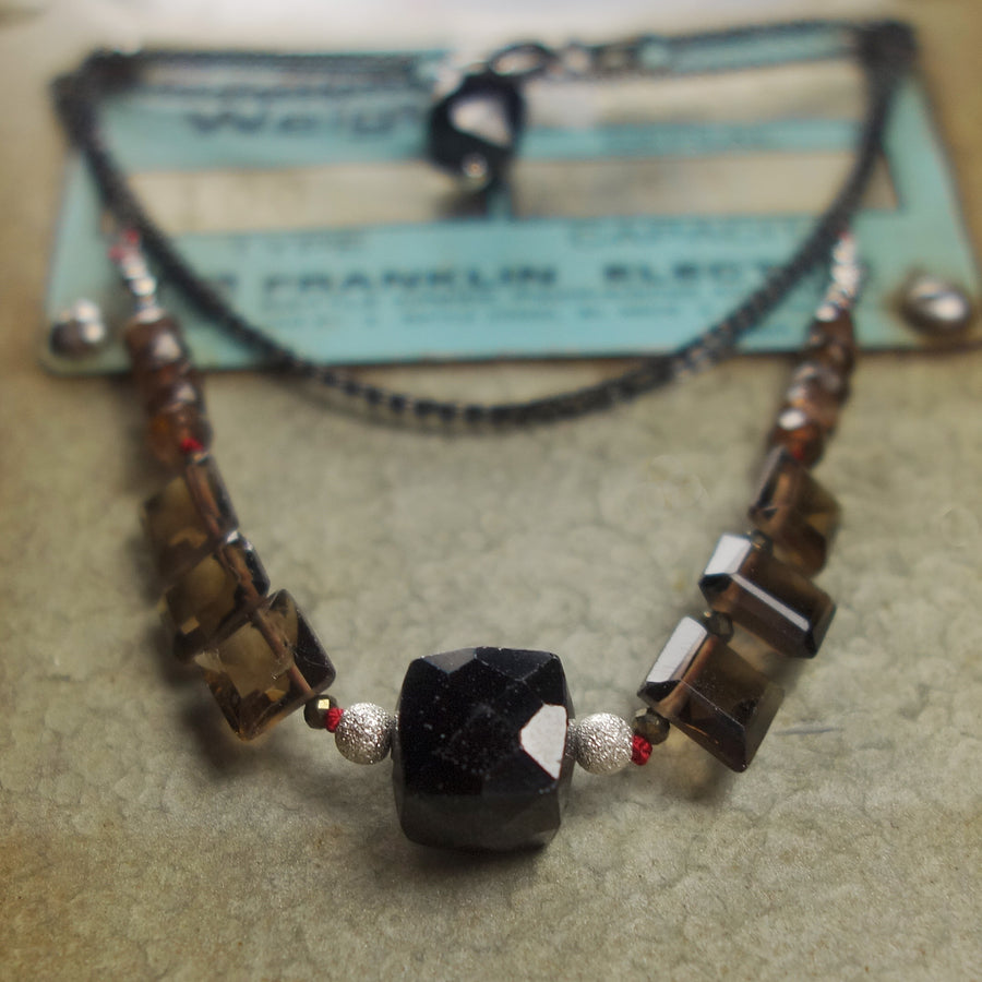 Her Voice is Heard: topaz and onyx necklace