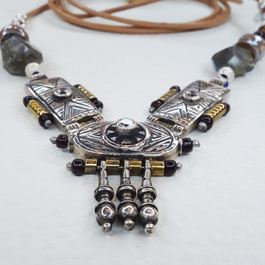 She Stood Her Ground: silver, gold, garnet, and white sapphire necklace