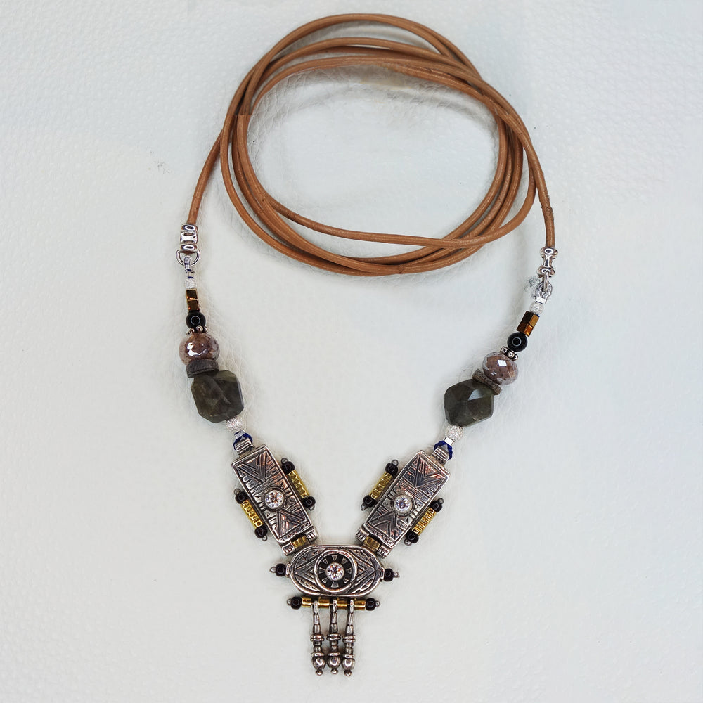She Stood Her Ground: silver, gold, garnet, and white sapphire necklace