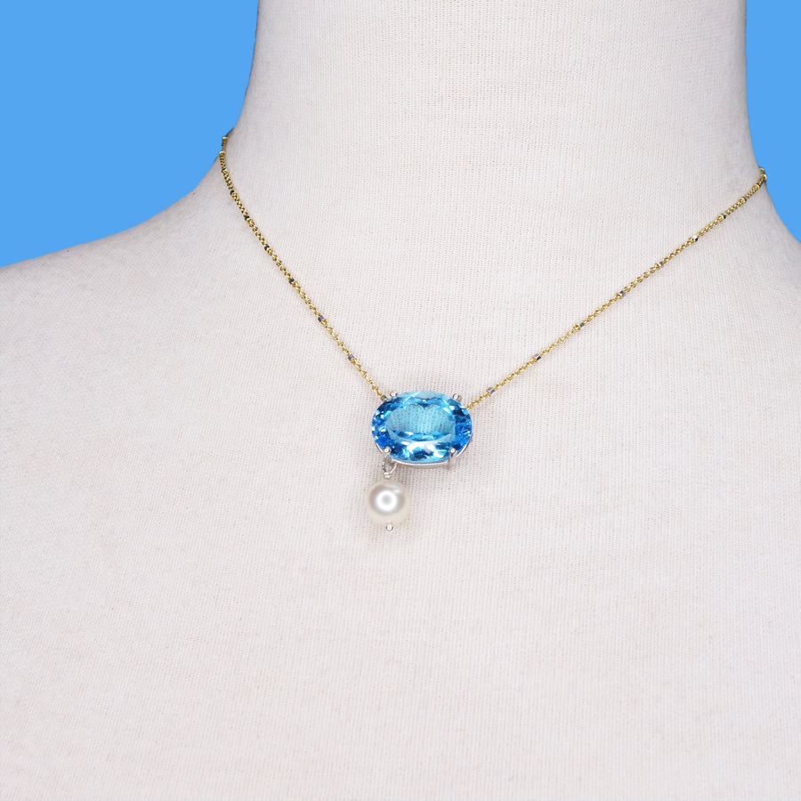 She Moves in Hues of Blues: Swiss topaz, pearl, and gold