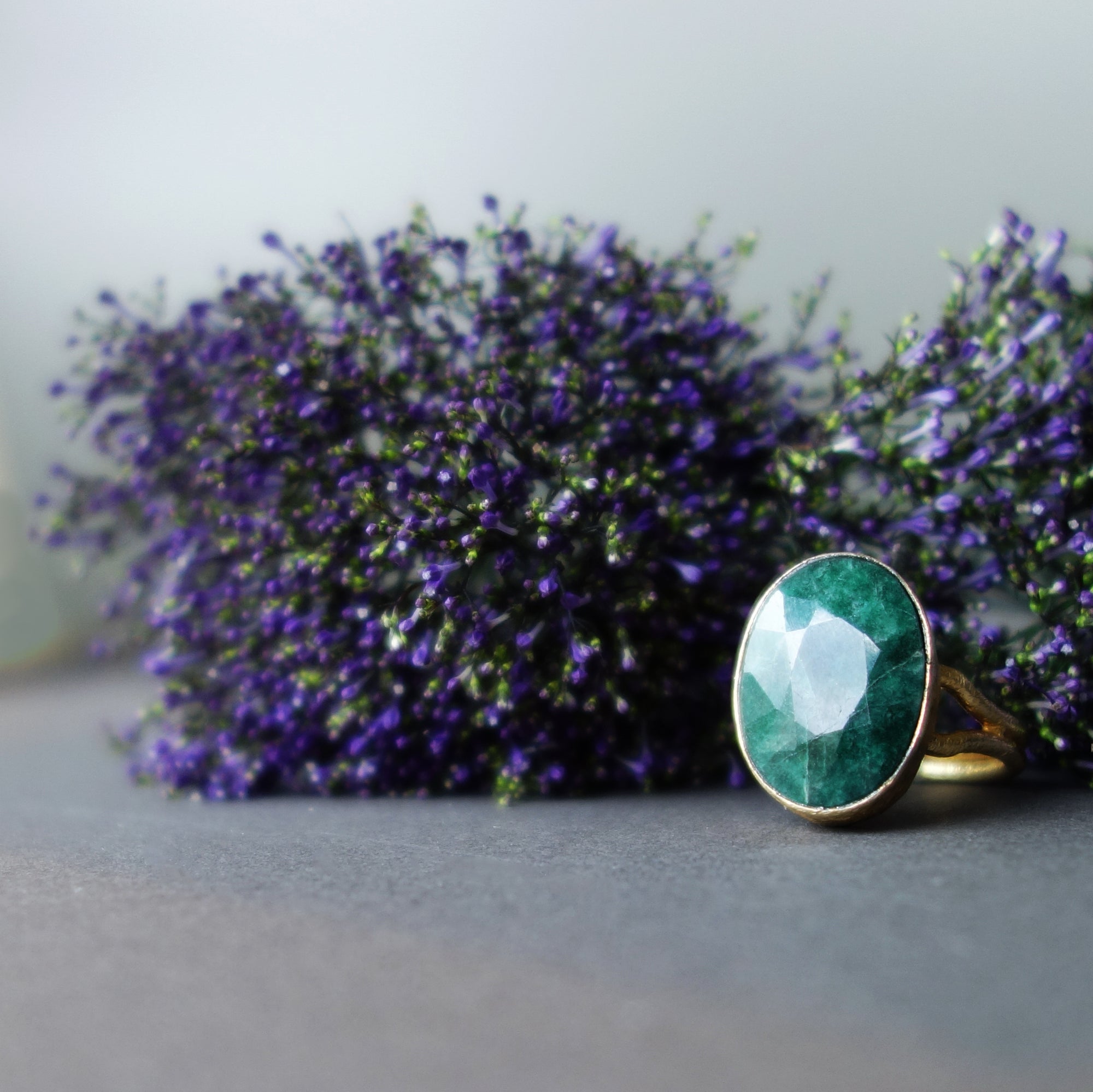Faceted Emerald in Gold Ring