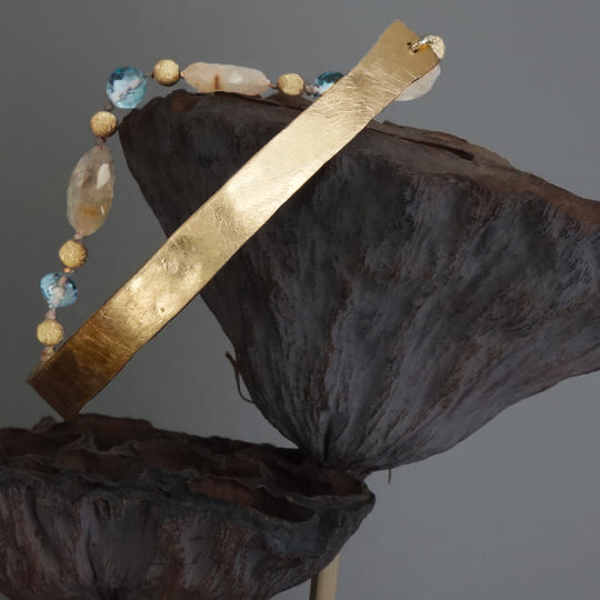 Bangle Me Beautiful (hand hammered gold and blue topaz bracelet)