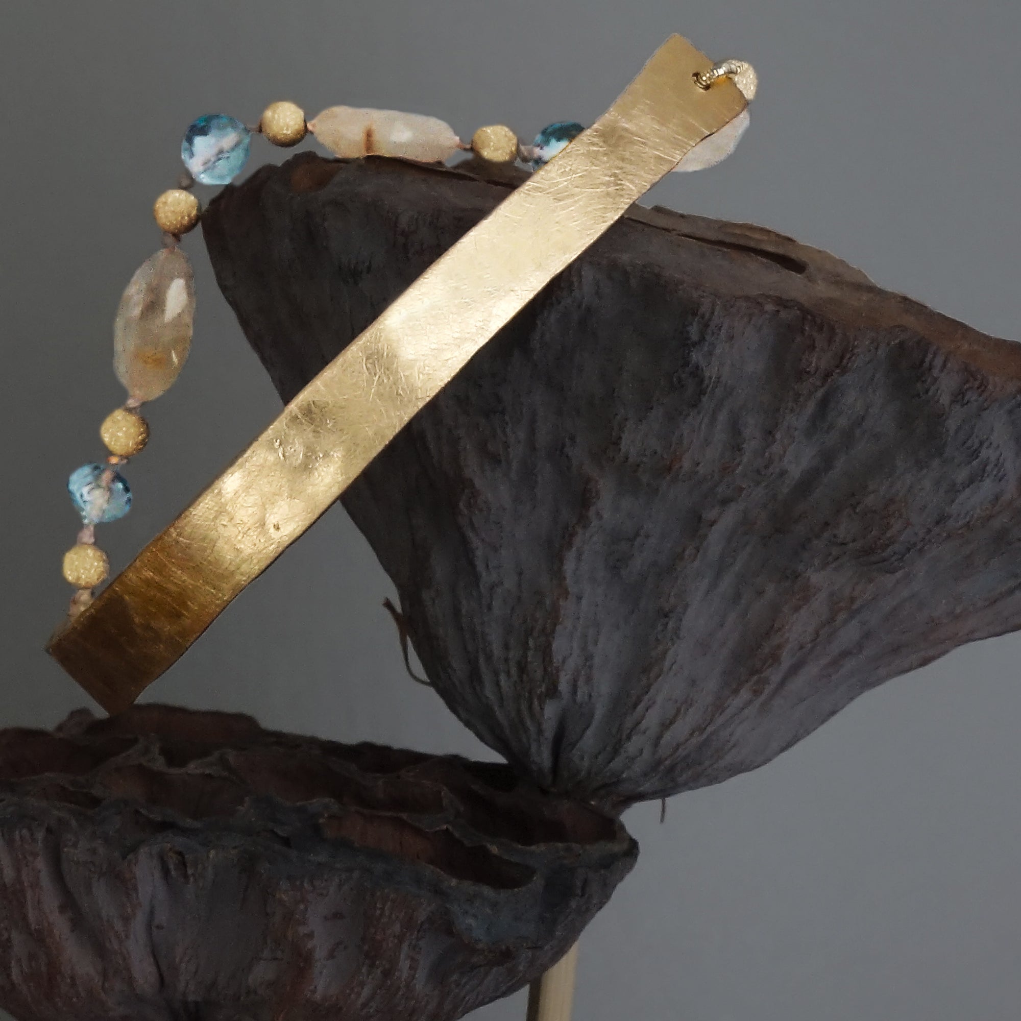 Bangle Me Beautiful (hand hammered gold and blue topaz bracelet)