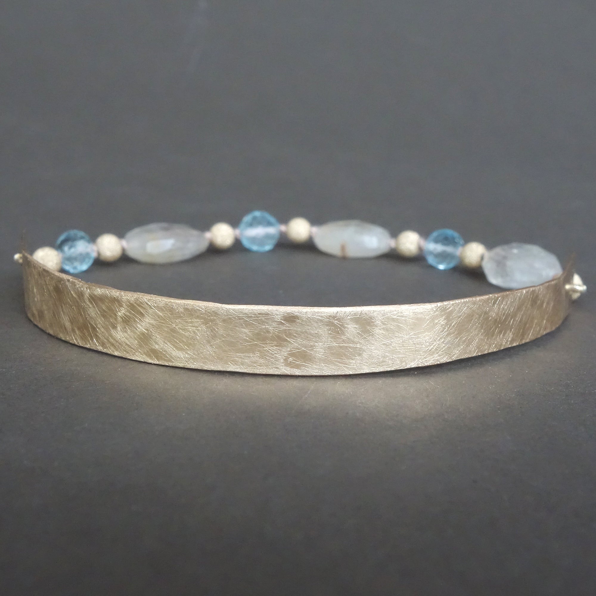 Bangle Me Beautiful (hand hammered gold and blue topaz bracelet)